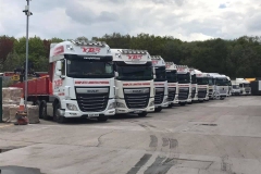 Fleet of trucks parked in a truck yard