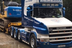 Long nose scania truck with low loader trailer