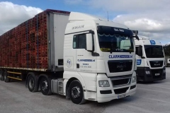 Clark Transport Ltd MAN loaded with pallets on flatbed trailer