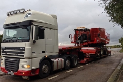 DAF-XF-truck-low-loader-loaded-with-combine-harvester