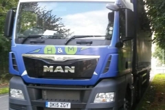H & M MAN truck with curtainsider trailer