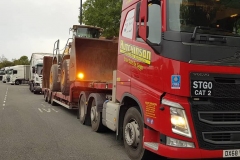 Hutchinson Engineering Services Volvo FH low loader with loading shovel on trailer