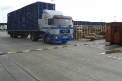 MAN Truck flatbed trailer loaded with pallets