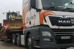 Runtech MAN Truck with low loader carrying Kamatsu Bulldozer