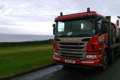 Scania R410 Rigid low loader loaded with a Construction vehicle