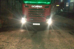 Red Scania Tractor Unit at night with green LED lighting